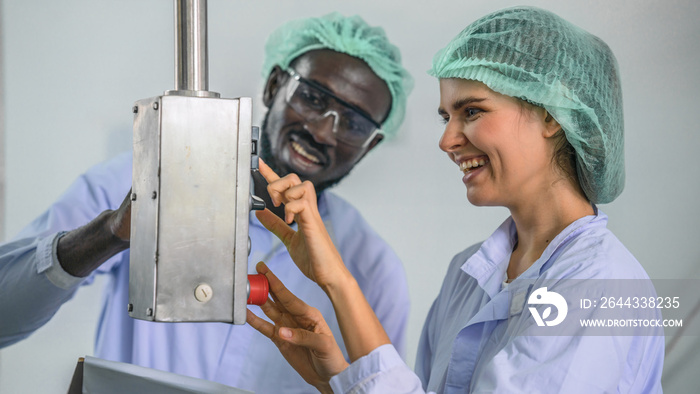 beverage factory production line supervisor and worker working together