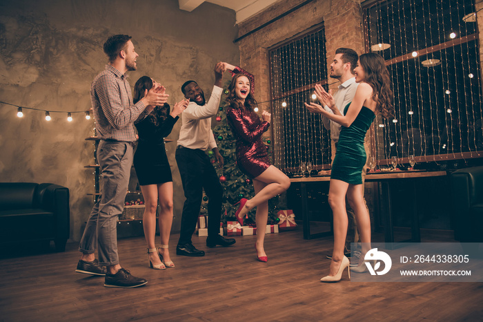 Full body photo of cheerful man and woman dancing enjoying christmas party x-mas holidays wearing dress high heels white plaid shirt pants in house with newyear illumination indoors