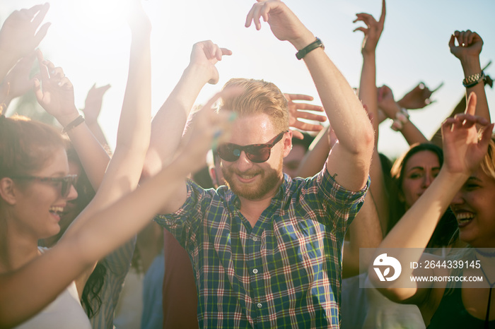 Group of people dancing at outdoor festival