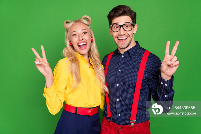 Photo of young beautiful girl handsome guy show peace victory symbol v-sign lifestyle isolated over green color background