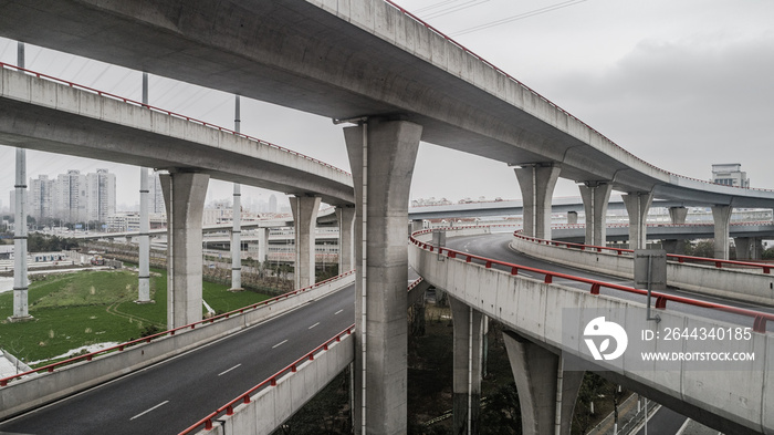 Aerial view of highway and overpass in city on a cloudy day