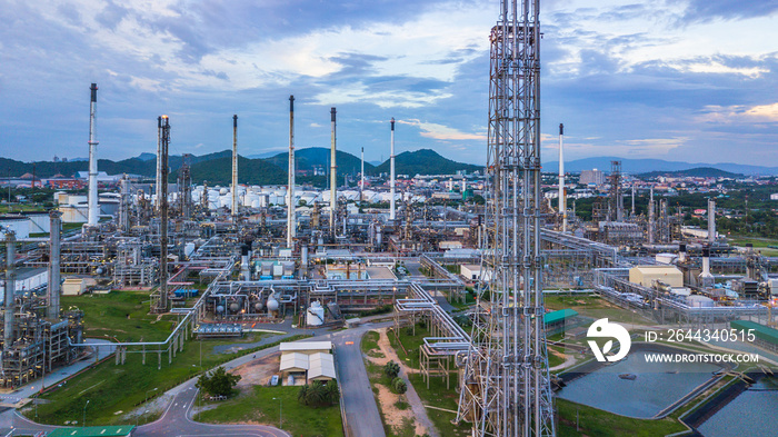 Aerial view of large fuel storage tanks at oil refinery industrial zone, White oil storage tanks farm.