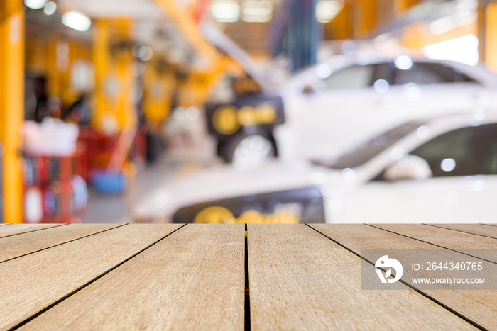 Wooden board empty table top and blur interior over blur in car service Background, Mock up for display of product.