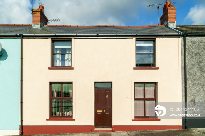 Old fashioned architecture buildings of colourful terraced town houses in Pembrokeshire Wales UK, stock photo image