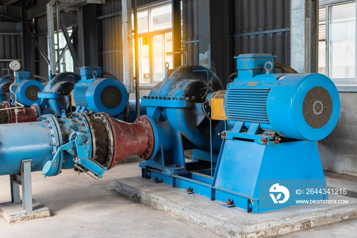 Engineering works with the tablet in the production control room.Control room of a steam Turbine,Generators of Oil refinery industry plant for monitor process, business and industry concept