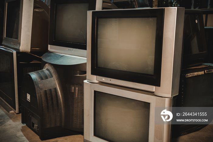 Pile of old TVs in repair shop. Tube television receiver, CRT