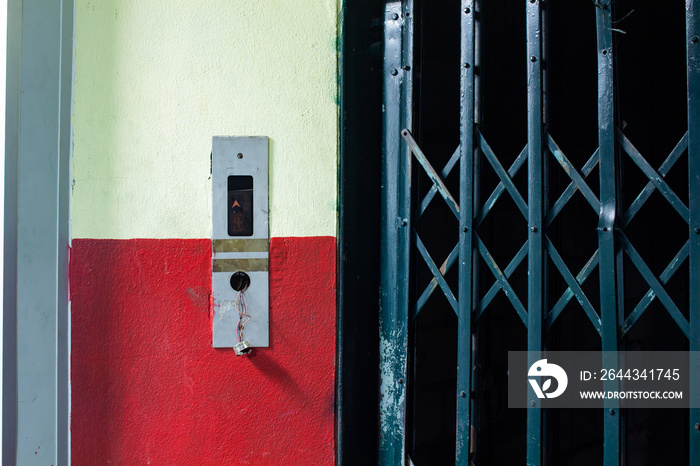 The old elevator switch on the wall