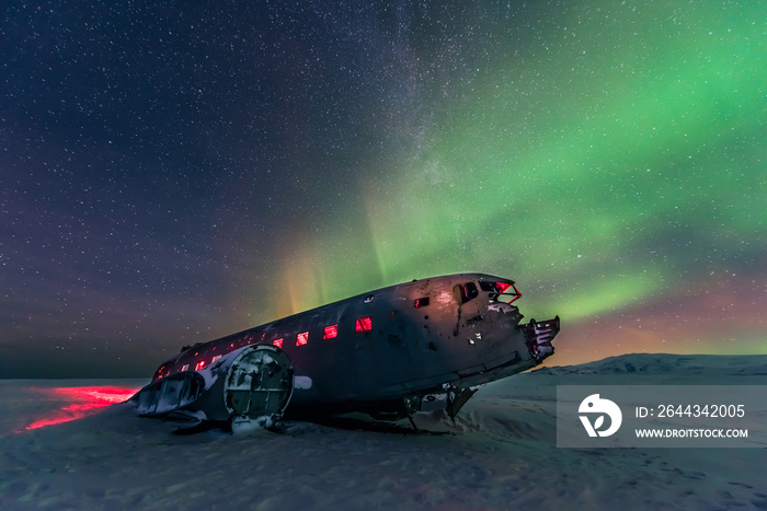 Northern lights over plane wreckage in Iceland