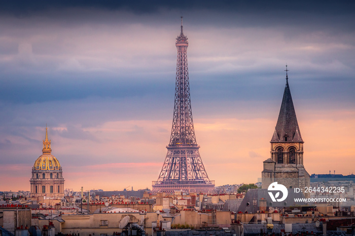 Eiffel tower and parisian roofs at sunrise Paris, France