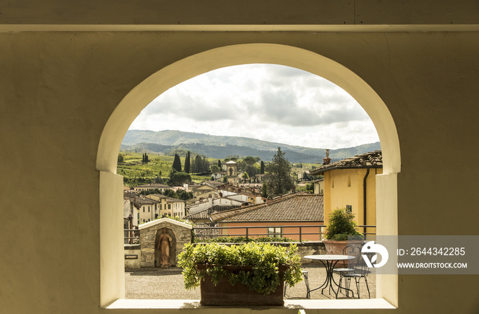 Panoramic view of Greve in Chianti, Tuscany, Italy, seen through arch