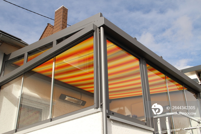 a modern new conservatory with awning