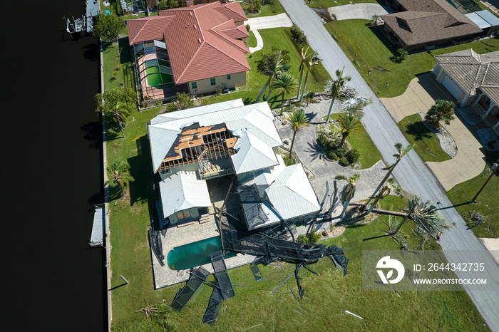 Hurricane Ian destroyed house in Florida residential area. Natural disaster and its consequences