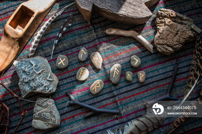 Rune stones on a wooden table. Future reading concept.