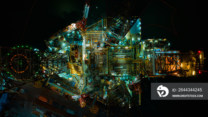 Oil Drilling Rig top view, Aerial view of jack up rig with plant maintenance services at night .