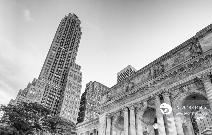 Buildings of Fifth Avenue along Manhattan Public Library at autumn sunset, New York City