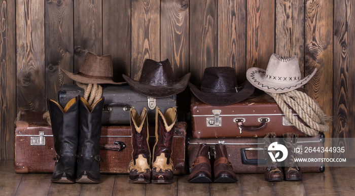 Old suitcases, hats and cowboy shoes