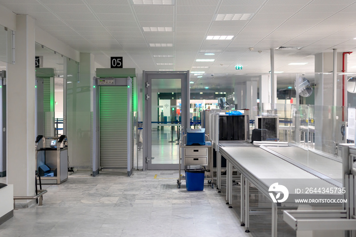 in the airport building there is a baggage screening area for the purpose of flight safety. No passengers or suitcases