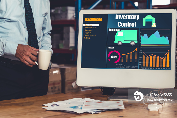 Warehouse management software application in computer for real time monitoring of goods package delivery . PC screen showing smart inventory dashboard for storage and supply chain distribution .