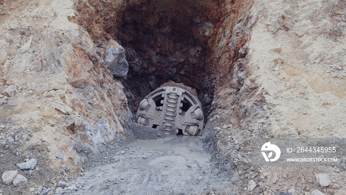 Front view of small tunnel boring machine on construction site.