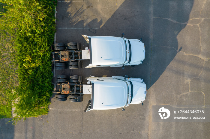 Industrial freight trucks sitting in a parking lot