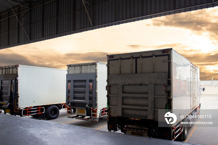 Cargo Trucks the Parking lot at The Sunset Sky. Delivery Trucks. Cargo Shipping. Lorry. Industry Freight Truck Logistics Cargo Transport Concept.