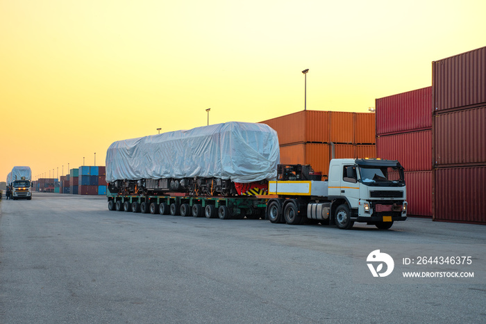 Heavy duty truck  Loading electric diesel locomotives At the port, waiting for customers