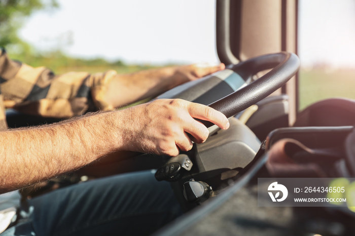 Young man driving modern truck