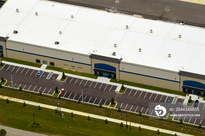 Aerial view of industrial park with goods warehouses and logistics centers in city zone from above