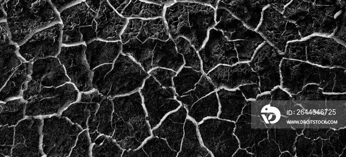 abstract black background with white cracks overlay ground cracked drought, old paint