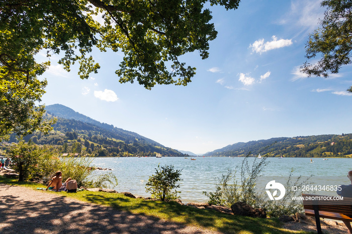 View over the Alpsee near Immenstadt to the opposite shore with mountains and forests