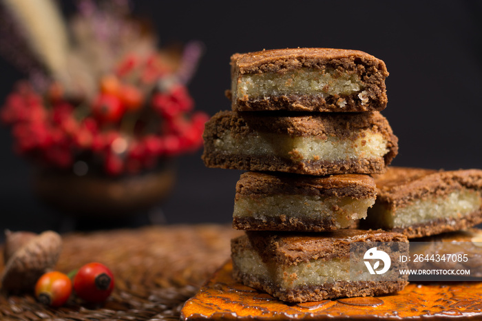 Typical Dutch filled spicy  cookies with almonds in autumn colors