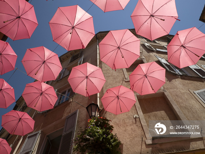 Grasse France pink umbrellas street