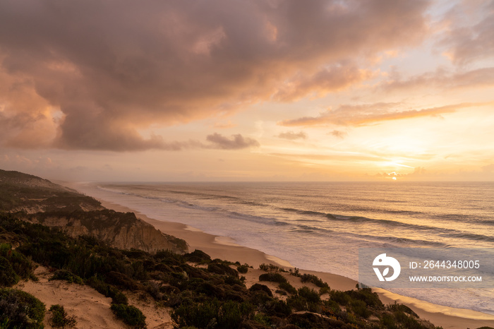 beautiful sunset with beach and sand dunes on the Alentejo coast of Portugal