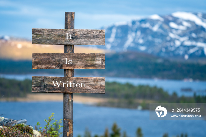 it is written text quote on wooden signpost outdoors in nature during blue hour.