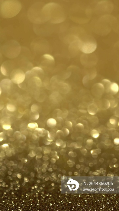 Shiny golden surface rotates. Magic bokeh background