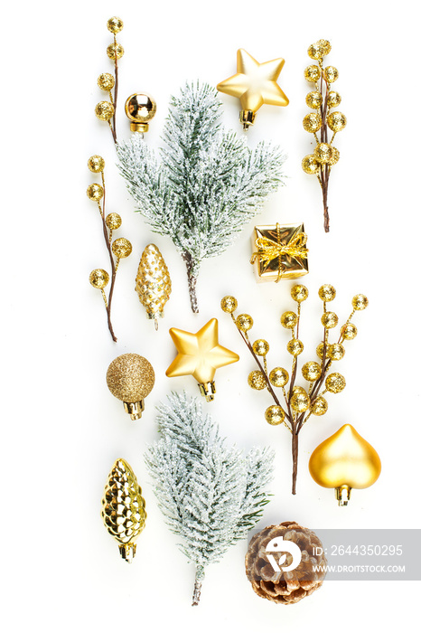 Christmas composition on white background. Golden decorations and winter fir twig isolated. Christmas or New Year concept. Flat lay, top view