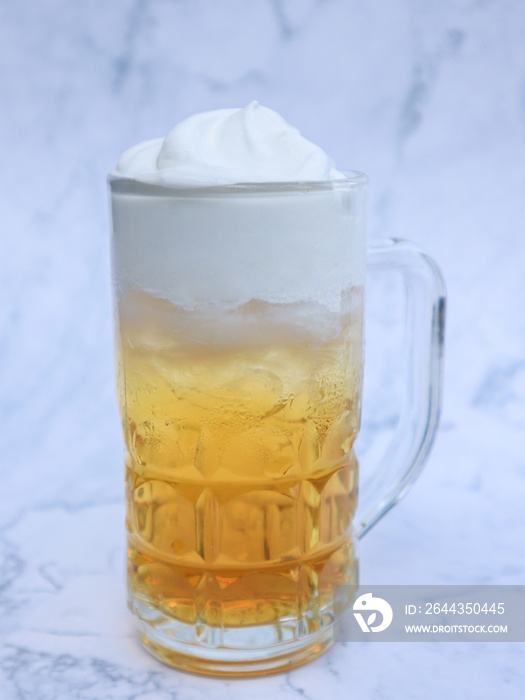 Butterscotch Butter Beer in a glass on white blackground, Sweet Homemade