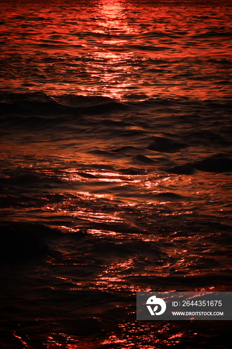 Abstract gradient texture of sunset reflection in the sea water