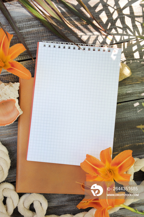 Notebook mock up with lily flowers, outdoor summer photo