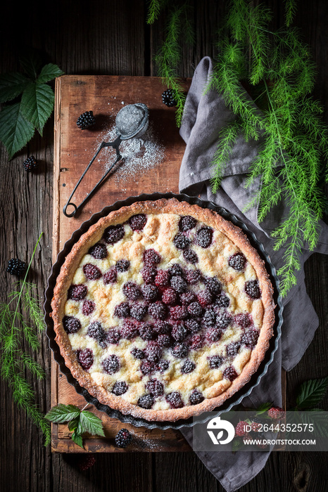 Top view of sweet blackberry pie made of fresh fruits