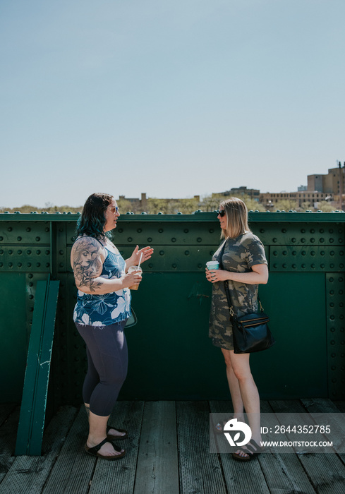 portrait of 2 friends talking