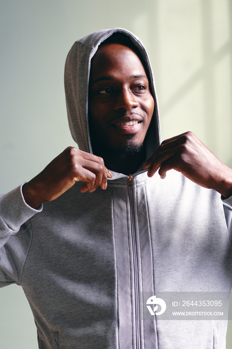 Portrait of mid adult man in hoodie