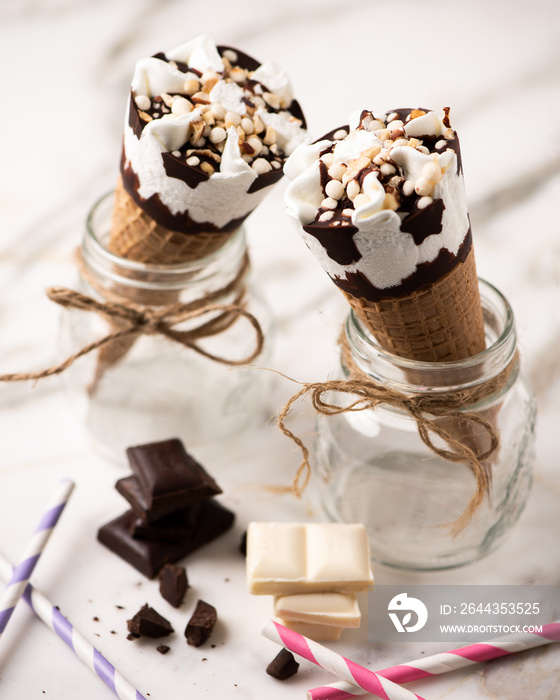 Two cornetto ice cream. Vanilla ice cream on wafle on white background