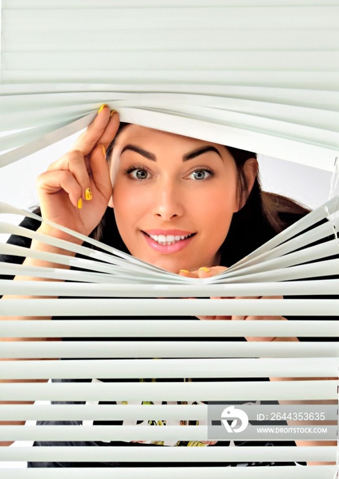 girl peeking through white iron blinds