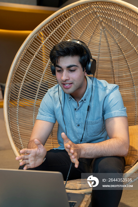 Young businessman during video call in office