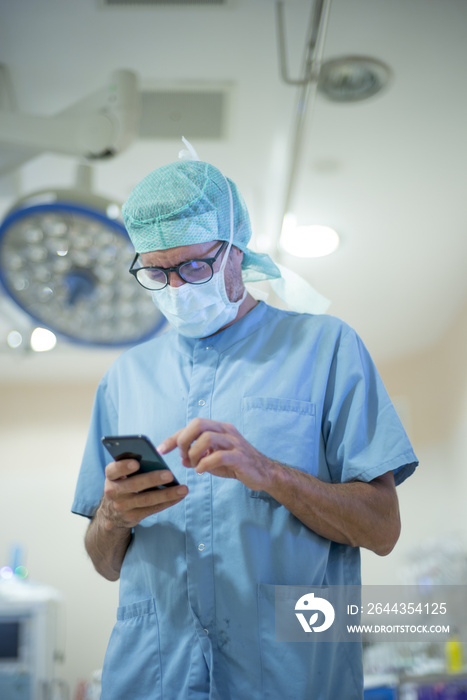 Male doctor using smartphone