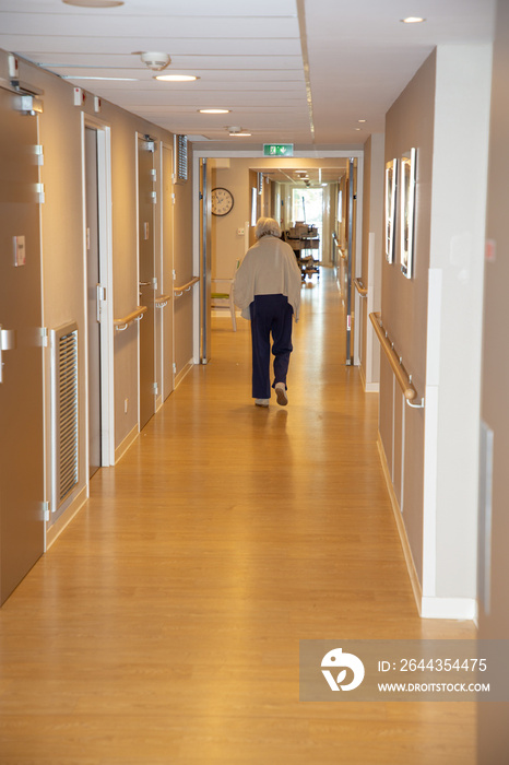 Elderly old woman in the hallway of a retirement home