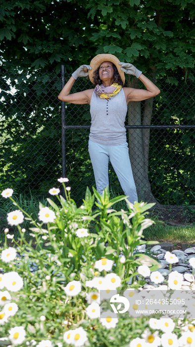 Senior woman standing in garden