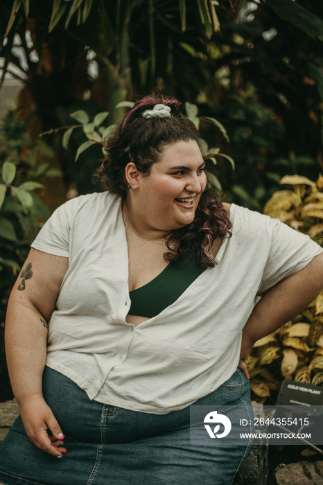 portrait of a plus size woman looking and laughing