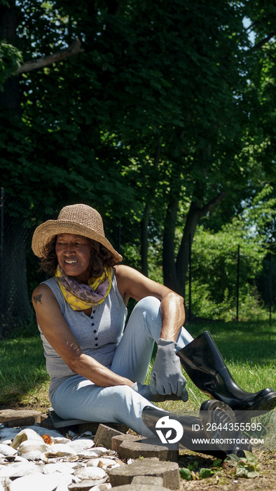 Senior woman sitting in garden